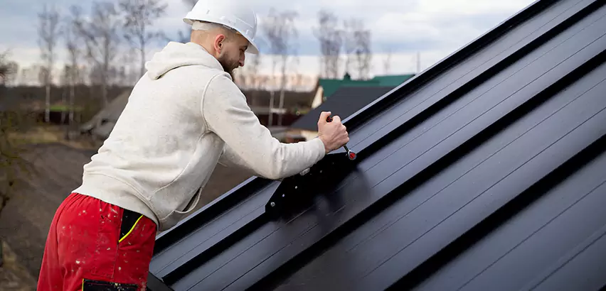 Tin Roof Ridge Cap Installation in Janesville
